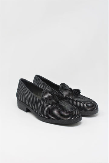 The Petra loafer reinterprets a timeless luxurious style. Crafted in black dotted Italian suede, it showcases the companies signature lightweight design. Featuring thick soft rubber soles and suede tassels, the Petra puts an emphasis on comfort. The loafer is a supple and cosy creation for everyday use.